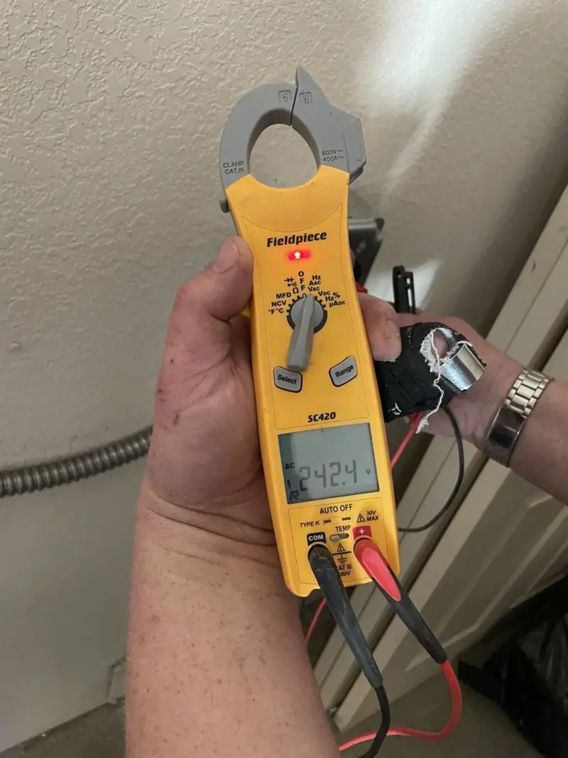 Voltage testing with clamp meter during Electrical Installation Services in Washington